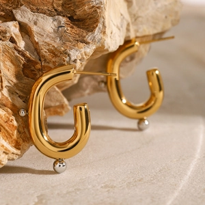Chic U-shaped gold stainless steel hoop earrings with silver bead accents on stone base