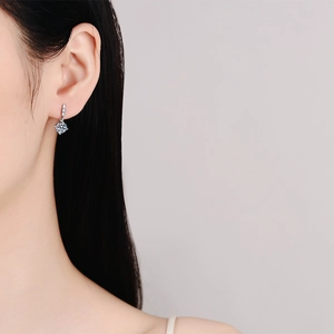 Elegant S925 silver drop earrings featuring a square moissanite stone on a model