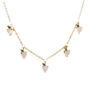 Golden necklace with five pink peach heart pendants and green leaves on white background