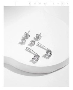 Macro view of s925 silver stud earrings with adjustable back attachments and zircons