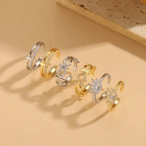Set of 6 geometric open rings with sparkling zircons in gold and silver tones