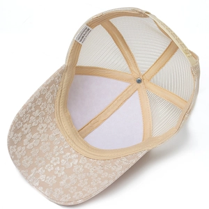 Beige floral lace trucker hat with breathable mesh and adjustable back closure