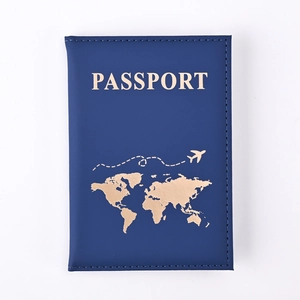 Detail of deep blue PU leather passport holder featuring gold foil world map design