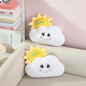 Detail of soft cloud and sun plush pillows featuring You Are My Sunshine embroidery