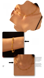 Detail of 18k gold plated necklace and bracelet set with delicate floral sphere design
