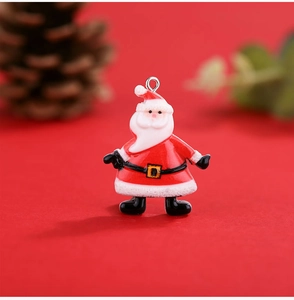 Close-up of Santa Claus resin pendant with metal ring for DIY Christmas tree decor