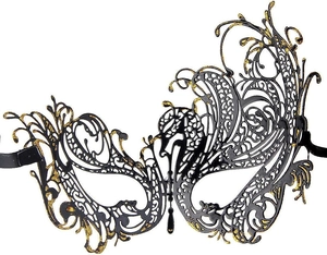 Close-up of black and gold laser-cut metal mask with intricate butterfly hollow details