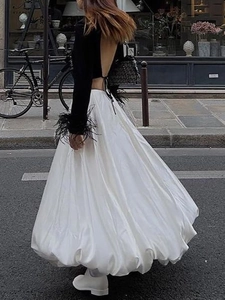 French style street fashion set featuring a black feather top and white A-line maxi skirt
