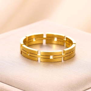 Macro shot of 18K gold plated stainless steel geometric chain ring with hollow design
