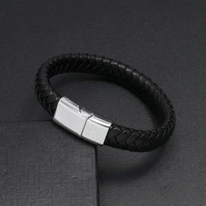 Detail of black braided leather bracelet with square silver magnetic clasp on display box