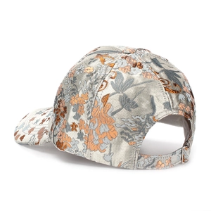Close-up of floral embroidery on a vintage baseball cap with metallic jacquard texture