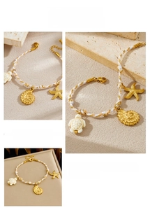 Detailed shot of woven ocean bracelet with gold starfish, seashell and turtle charms