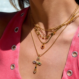 Layered 18K gold stainless steel necklace with orange heart pendant and crystal cross