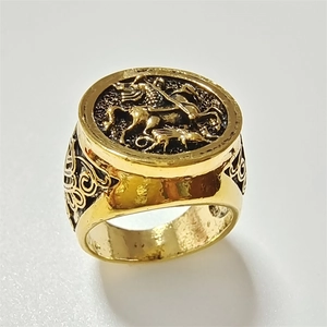 Vintage gold Saint George and the Dragon signet ring with baroque scrollwork