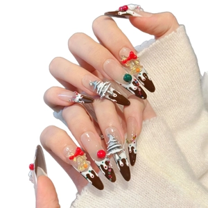 Handmade Christmas press-on nails with 3D snowman, chocolate cake design and red bows