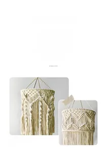 Detail of handcrafted bohemian cotton rope lampshade with macrame weave and tassel fringe
