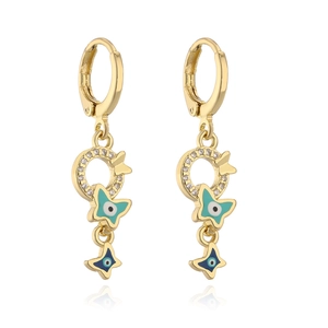 Detail of 18K gold butterfly evil eye pendant earrings with blue crystal accents