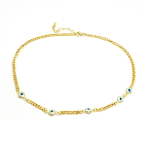 Macro detail of golden Evil Eye chain necklace with lobster clasp and extension links