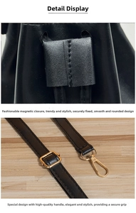 Detail of black leather drawstring bag with golden lobster clasp and adjustable metal buckle