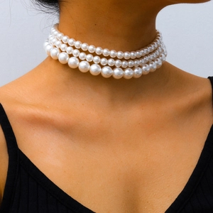 Three-layer bohemian white pearl choker necklace displayed on a model for elegant styling