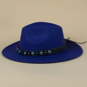 Detailed view of deep blue felt fedora with turquoise beads and silver metal studs on leather band