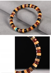 Macro detail of high density multicolored wooden prayer beads with turquoise accent