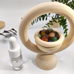 Detailed view of natural wood essential oil diffuser ring with colorful crystal stones