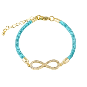 Close-up of infinity symbol charm with diamonds on light blue braided cord bracelet