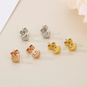 Boucles d'oreilles cœur polies en argent, or et or rose avec fermoirs papillon