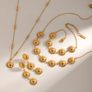 Detailed set of 18k gold plated sunflower necklace, bracelet and earrings in stainless steel