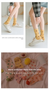 Detail view of cotton crew socks with colorful vegetable and fruit jacquard patterns