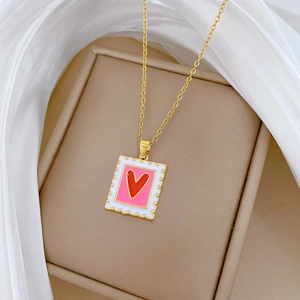 Luxurious gold stainless steel necklace with a square enamel heart pendant and rhinestones