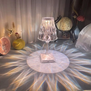 Touch control crystal LED table lamp creating rose petal light patterns on the table