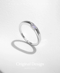 Side view of an elegant S925 silver ring featuring a sparkling rectangular clear stone