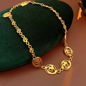 Vintage gold infinity necklace with hollow rose flower pendants on luxury velvet box