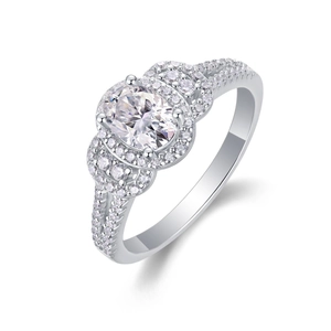 Macro shot of oval moissanite ring showing halo setting and diamond band detail