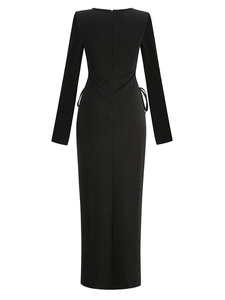Detail of black maxi dress featuring beaded square neckline and side cut-outs with drawstrings