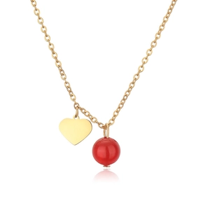Minimalist gold stainless steel heart and red stone pendant necklace on white background