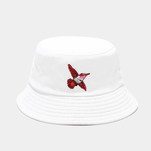 Close-up of red hummingbird embroidery on the white breathable cotton bucket hat
