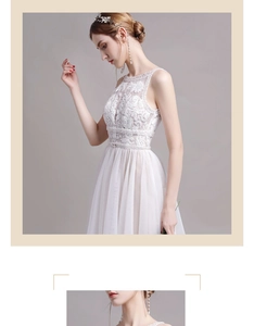 Détails de broderie sur robe de mariée en dentelle blanche avec perles à la taille