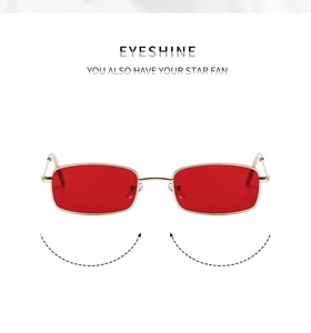 Detail of red lenses and gold rectangular metal frames with elastic temples design