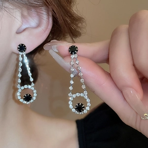Elegant silver tassel earrings set with black stones and pavé crystals for women