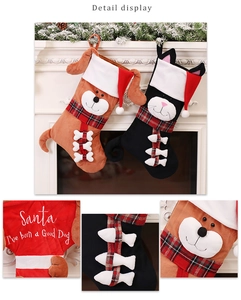 Close-up of pet Christmas stockings with plaid scarves and Santa embroidery