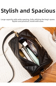 Top view of open black quilted cylinder bag interior showing ample storage space