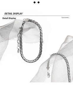 Detail of S925 sterling silver snake bone woven bracelet with heart clasp and pendant