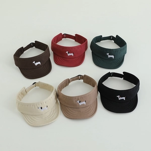 Detailed view of six sun visors with dachshund embroidery in various classic colors