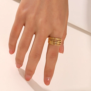 18K gold plated multi-layer crisscross stainless steel ring on female hand