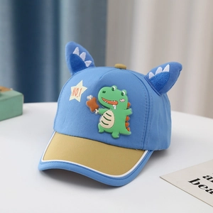 Detail of blue and yellow cotton kids baseball cap with cartoon dinosaur and cute ears