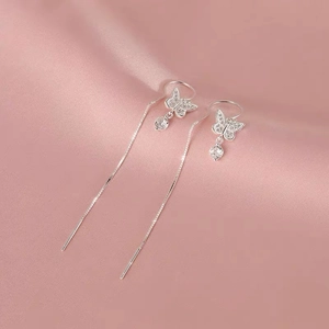 S925 sterling silver bow earrings with long tassel chains and zircon on pink silk fabric