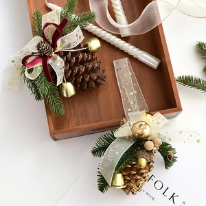 Christmas pinecone ornament with golden bells, red velvet ribbon, and pine needles set